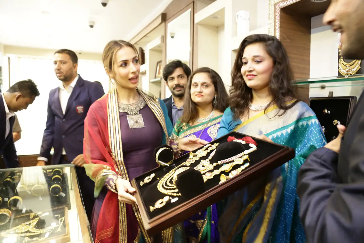 Man in suit speaking at podium with ITT logo on podium